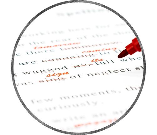 an image that shows proofreading and editing services on paper